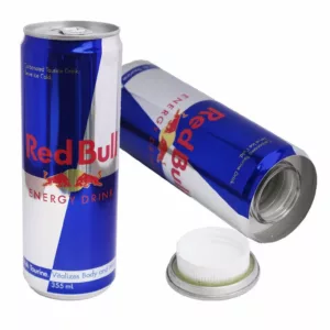Red Bull can on white background, open with white cap and logo, sitting on white surface with no visible contents inside.