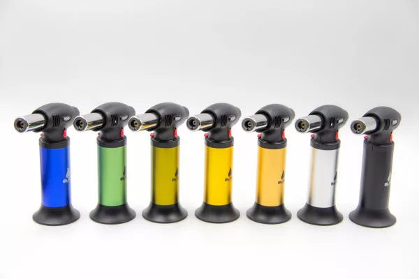 MB04 Blink gas torch with long handle and yellow flame. Available in black, yellow, and green colors.