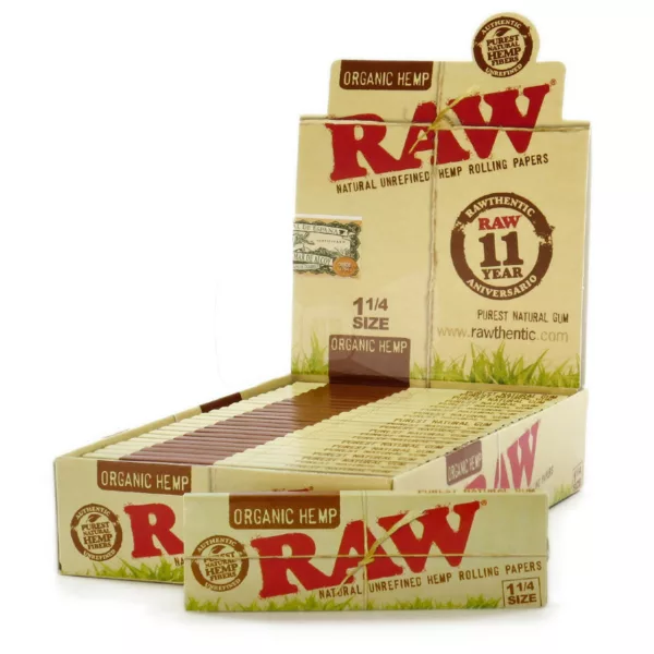 Empty cardboard box with clear plastic window and white label displaying 'Raw Rolling Papers'.
