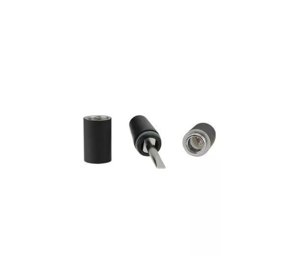 Black plastic cylinder with metal cap and small hole, sitting on white background.