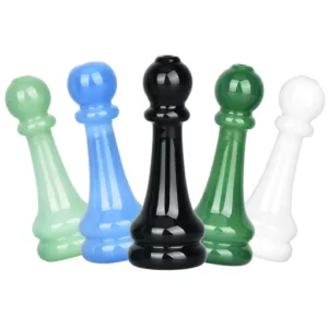 Colorful chess pawn chillum with intricate designs, adds depth to the image.