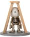 Vintage skeleton on weathered ladder, reaching for luck. Lucky Under Ladder - Pacific Trading.