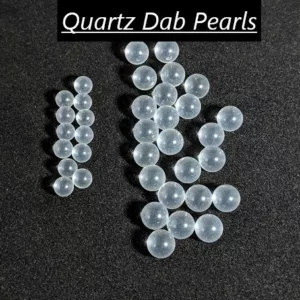 These clear, round quartz pearls are smooth, shiny, and blemish-free, likely to be used in jewelry or decorative items. The well-lit image showcases their elegance and sophistication.
