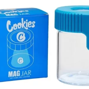 White jar with blue lid on white background containing a white liquid that could be cereal or cookies.
