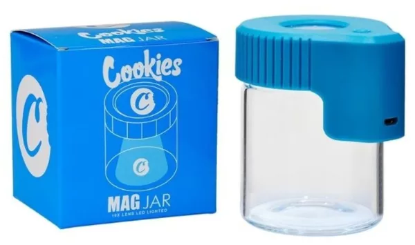 White jar with blue lid on white background containing a white liquid that could be cereal or cookies.