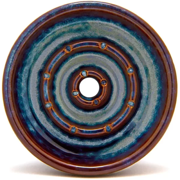 The Olympia Hookah Bowl - BYO has a blue and brown circular design on a ceramic plate with a brown center and blue and brown stripes around the edge.