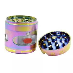Metal ashtray grinder with red, orange, and yellow holographic design, small round indentation with yellow holographic pattern, sits on white background.