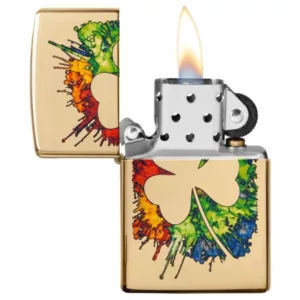 A vibrant, gold-finished Zippo lighter with a colorful shamrock design surrounded by splatters of paint. Perfect for any fan of Irish-themed烟品.
