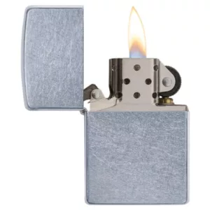 Silver metal lighter with rectangular shape and open flame on white background.