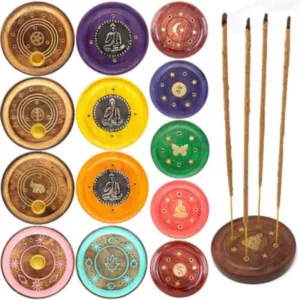 Set of 8 circular wooden incense holders with intricate designs and metal pegs on a wooden base. Each holder contains small sticks of incense.