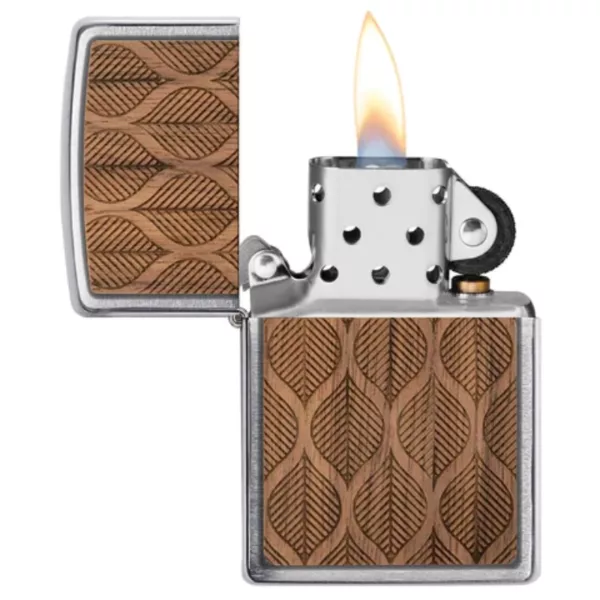Hand-carved wooden Zippo lighter with intricate geometric patterns and brass accents. Flame visible on surface.