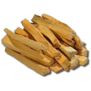 Natural Palo Santo wood sticks for smoking, stacked in a pile with a white background.