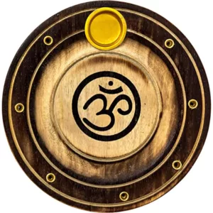 Wooden disc with om symbol in center, surrounded by black circle with yellow border. Mounted on white background.