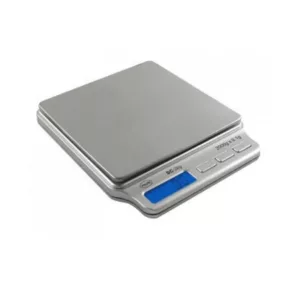 The AWS-501 digital scale has a blue display on a white background and a silver casing. It shows weight in grams and kilograms and has a small footprint, making it easy to carry around. The scale is designed for precision and accuracy.