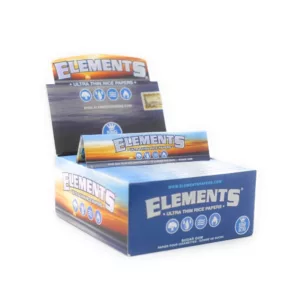 Blue and white Elements King Size Slim cigarettes in a standard cardboard box with clear plastic window.