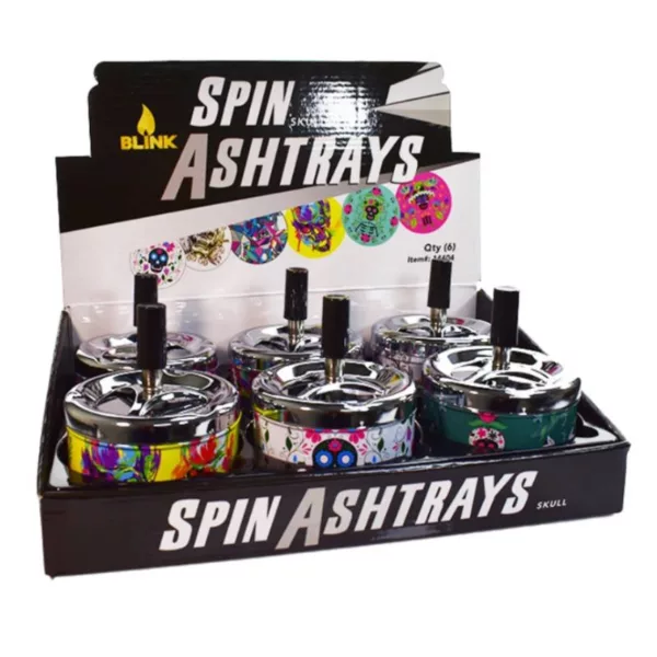 An image of a transparent display case with several spinning metal ashtrays with colorful designs, likely being used to showcase the ashtrays in a store or at an event.