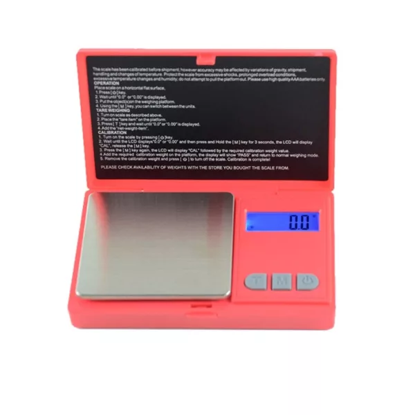 Portable digital scale with black display and red button. Measures weight accurately and is useful for tracking food intake or weighing small objects. Compact and easy to use.
