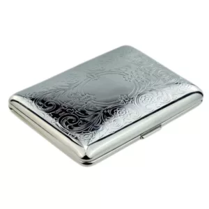 A silver metal cigarette case with intricate floral designs, hinged lid, and polished finish. Suitable for holding cigarettes or small items.
