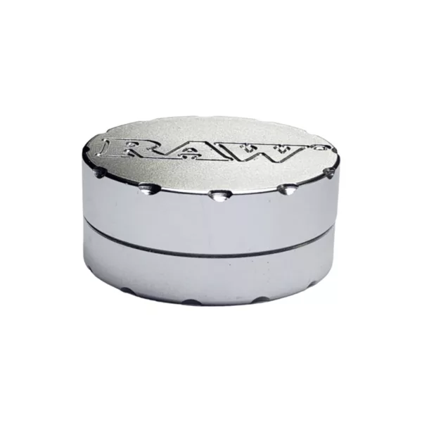 Dual-compartment silver tin with black and white logo for herb grinding and storage.