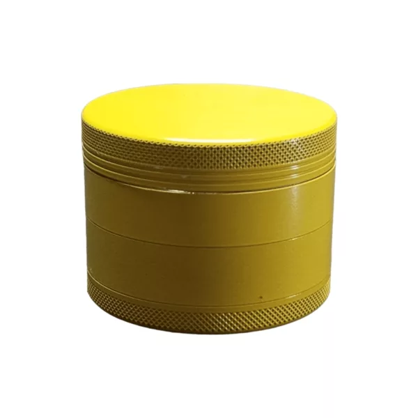 A yellow plastic grinder with a clear lid and metal handle, labeled with the company name and address on both sides.