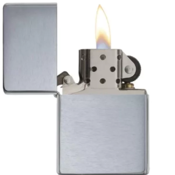 VINT BF CHR WO/Sl - Zippo rectangular silver lighter with lit flame on front, smooth metal casing on back. Flat bottom. Isolated image.