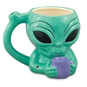 Green alien mug with oval shape, large eyes, round bottom, long handle, and holding a small cup. Perfect for coffee or tea.