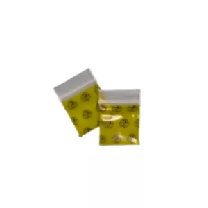 Clear plastic baggies with yellow pellets and zipper closure for storing smoking accessories.