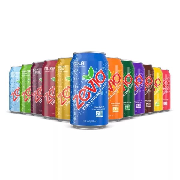 The image shows a line of six colorful cans of Zevia Zero Calorie Soda, each with a unique label and design. The labels feature images of fruit and bold text, and the overall design is modern and eye-catching. The cans are arranged in a line, with each one facing in a different direction. The image is likely intended to promote the product as a refreshing and healthy beverage.