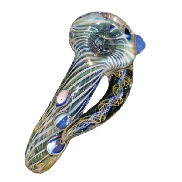A glass pipe with a blue and green swirling design sits on a white surface.