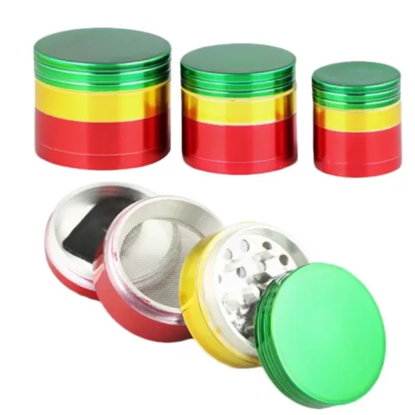 Set of three metal grinders in red, yellow, and green with a round shape and small hole for grinding herbs.