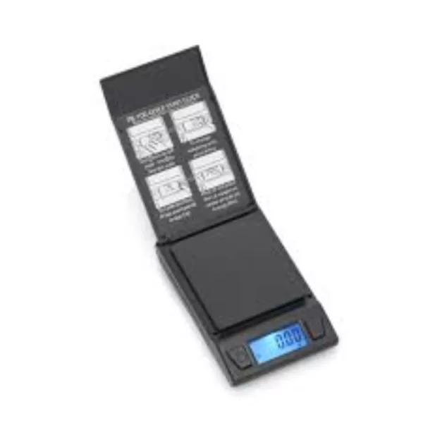 small, electronic scale with a black plastic case and silver button labeled ON. It displays weight in grams and kilograms.