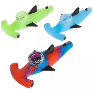 Three colorful plastic shark-shaped pipe holders, NNH239, with unique color schemes on white backgrounds.