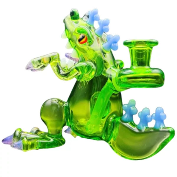 Reptar Water Pipe - GZL001 features a green lizard with blue eyes and sunglasses, holding a pipe cleaner in its mouth.