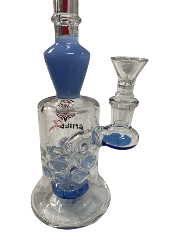 Glass water pipe with blue and white design on clear glass base. Base sits on white background. Design is a series of interconnected circles and lines.