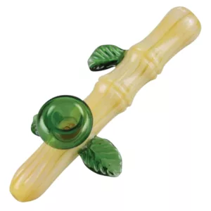 Handcrafted clear glass bamboo stick water pipe with green leaf accent.