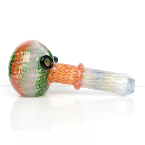 Handmade glass pipe with spiral design in green, red, and orange. Clear stem and small, curved bowl with small hole at top.