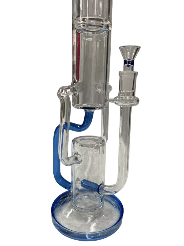 Stylish blue glass water pipe with clear glass base and handle, perfect for smoking. Displayed on a green table.
