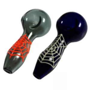 Pair of clear glass pipes with black and red spider web design on white background.