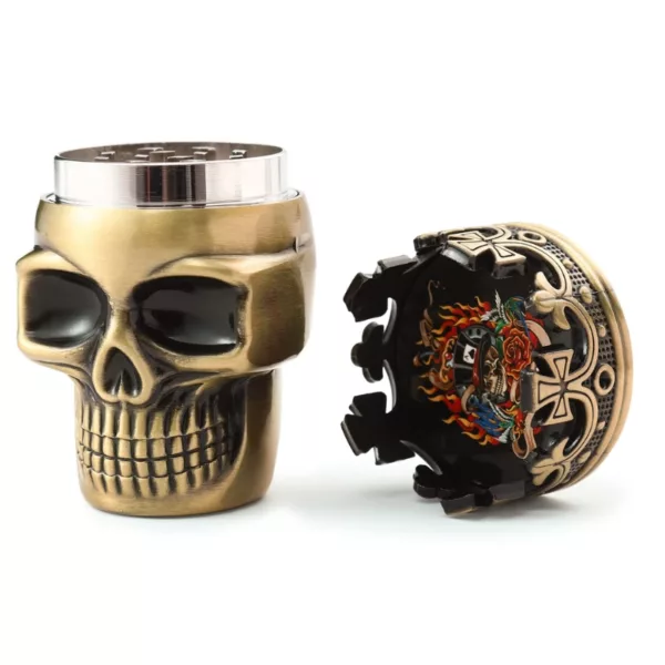 A skull-shaped can cooler with a metallic finish and intricate designs, perfect for smoking enthusiasts.