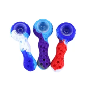 set of three glass pipes in red, blue, and white, with a curved base and straight stem. The red pipe has a small hole, while the blue and white pipes have larger holes. The image close-up view of the pipes.