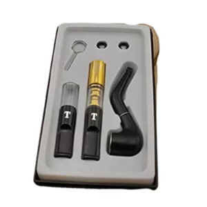 The Bend vaporizer comes in a black plastic and chrome package with a cleaning brush and a small bowl. It also includes a metal case with a white background.