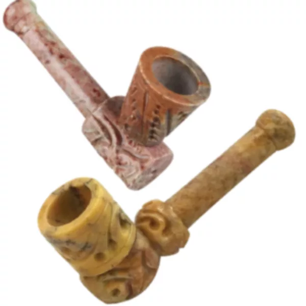 Hand-carved stone pipe with intricate designs, ornate wooden handle, and small smoking hole. Assorted styles. #APP3289