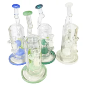Four glass water pipes in different colors, connected and standing on a white surface.
