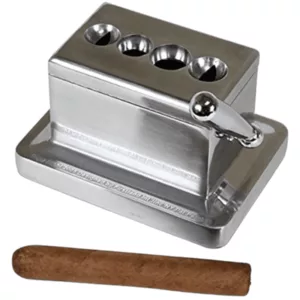 Metal cigar cutter in box shape with 4 holes, holds one cigar. White background.