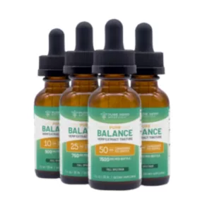 Three high-quality 'Balance' CBD oil bottles, labeled with different dosage levels (500mg-1000mg) and dropper cap. Well-packaged and labeled with brand name, company name, and contact info.