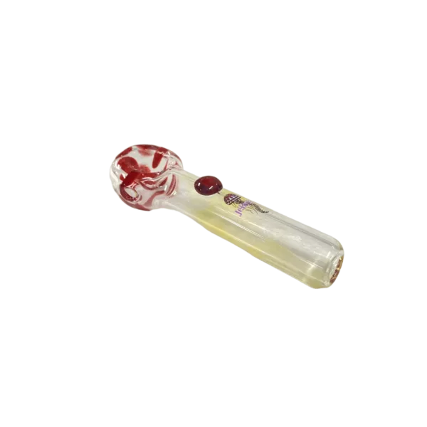 Jellyfish Glass jar with red and white swirl designs, transparent and sitting on a green surface. Perfect for a unique smoking experience.