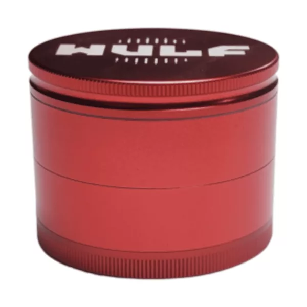 A red metal grinder with the word huff written in white letters. Made for grinding herbs and other materials into a fine powder. Durable and easy to use. Available in various sizes and colors.