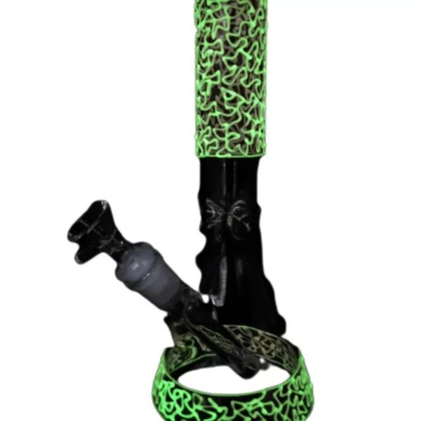 Black and green glowing vaporizer with clear tube and green handle. Small base and long neck, sitting on white background.