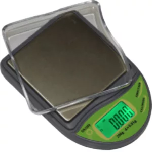 Green and black electronic scale with clear plastic cover and digital weight display in grams and kilograms.