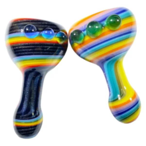 Two unique pipes with rainbow and clear designs, featuring small and large holes at the top and bottom. Set on white background.